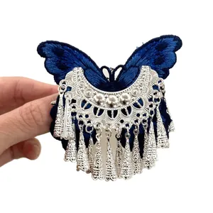 Vintage blue butterfly hair clip with silver tassel fringe for women's hair styling.