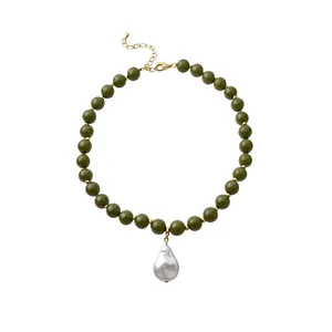 Elegant olive green acrylic bead choker with large baroque pearl pendant on white background