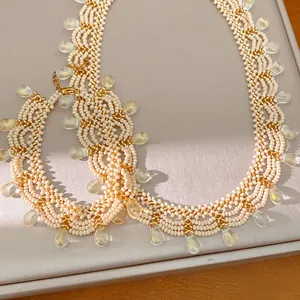 Close-up of vintage palace style lace beaded necklace with teardrop glass pendants