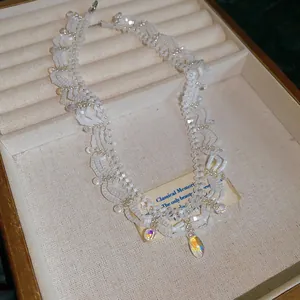 Vintage white beaded lace necklace with iridescent glass pendants in a gift box