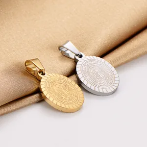 Close-up of Virgin Mary Guadalupe oval pendants in gold and silver stainless steel