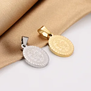 Detailed view of gold and silver Miraculous Medal pendants made of 18K gold plated stainless steel.