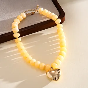 Bohemian acrylic marbled bead necklace with large gold metallic heart pendant detail