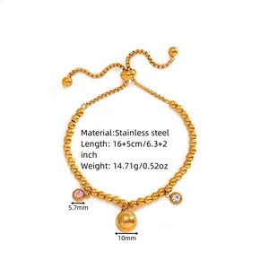 Gold stainless steel bead bracelet with pink and white crystal charms and slider.