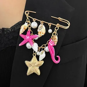 Exquisite ocean theme brooch with starfish and shell charms pinned on a black blazer lapel