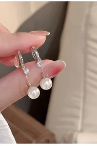 Elegant silver hoop earrings featuring a sparkling zircon and a round white dangling pearl