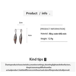 Detail view of resin distressed stone earrings showing 4cm length and material info