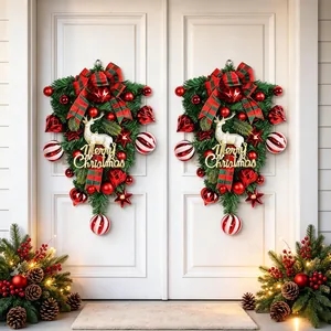 Festive elegant Christmas reindeer door swag wreath with red bows and ornaments for home