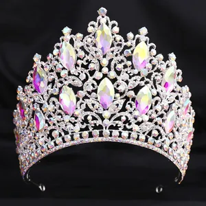 Detailed shot of a luxury bridal tiara featuring sparkling crystal leaves and iridescent gems