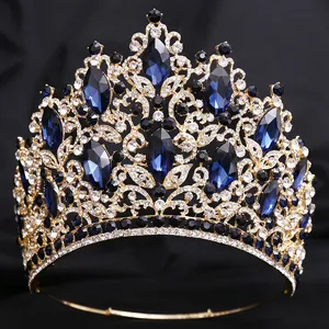 Detailed view of a luxury bridal tiara with blue marquise crystals and leaf motifs