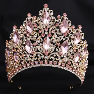 Detailed view of luxury pink crystal bridal tiara with elegant leaf rhinestone patterns
