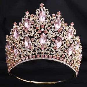 Luxurious gold bridal tiara with pink marquise crystals and clear rhinestones for weddings
