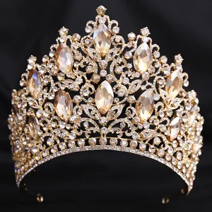 Detailed view of a luxurious gold leaf bridal tiara with champagne crystals and rhinestones