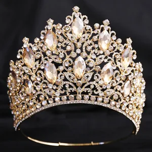 Detailed macro view of luxury gold bridal crown featuring elegant champagne teardrop crystals