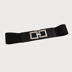 Detail view of women's black elastic waist belt featuring a silver square interlocking buckle