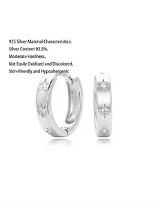 Detailed view of S925 sterling silver hoop earrings with engraved eight-point stars and stones