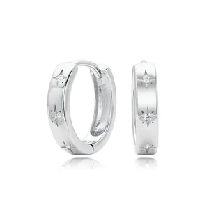 Detailed view of S925 sterling silver hoop earrings with engraved star patterns