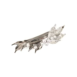 Detailed close-up view of a silver leaf-shaped alloy hair clip with white pearl accents.