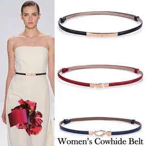 Detail showing various colors of women's thin cowhide leather belt with gold buckle.
