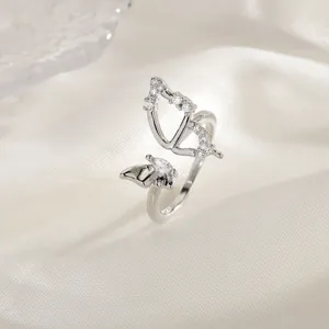 Elegant silver-colored hollow butterfly ring with sparkling cubic zirconia stones