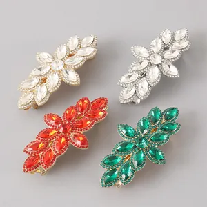 Macro detail of alloy spring hair clips with sparkling full rhinestones in four colors