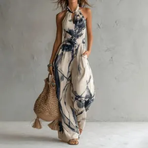 Elegant chic halter neck jumpsuit featuring abstract blue tropical print on beige