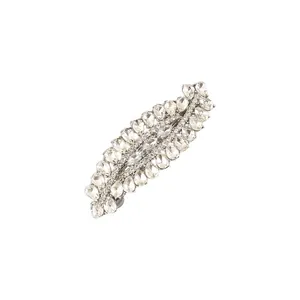 Detailed view of a silver-tone hair clip encrusted with sparkling pear-shaped rhinestones