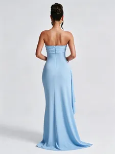 Detailed back view of a light blue strapless evening gown with elegant floor-length drape
