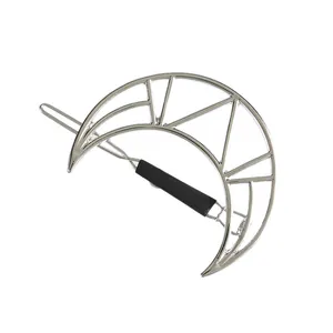 Detailed view of the silver geometric crescent moon hair clip with sleek metallic finish