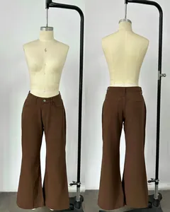 Front and back view of retro brown high-waisted wide-leg denim trousers on a mannequin
