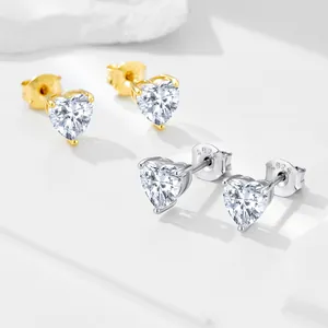 Detailed view of heart-shaped S925 sterling silver stud earrings with sparkling zirconia