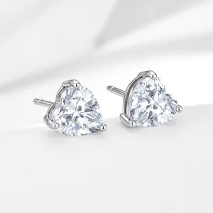 Macro view of sterling silver heart stud earrings with sparkling clear zirconia stones