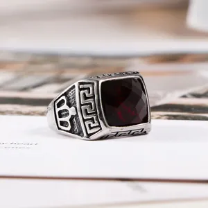 Vintage titanium steel ring with square red gemstone and Greek key engraving