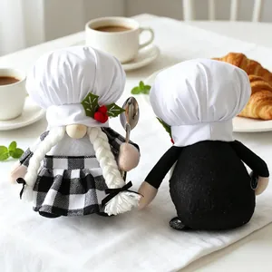 Handmade chef gnomes plush decor set with white hats and kitchen props on table.