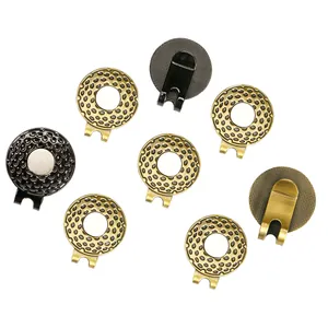 Magnetic golf ball marker hat clips in assorted metallic finishes with dimpled texture