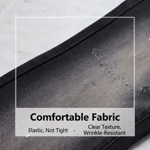 Vue détaillée de haute qualité du tissu denim noir avec texture extensible et souple