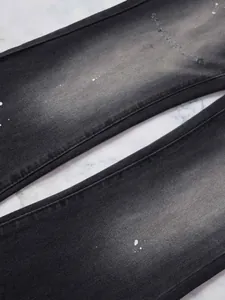 Jean évasé noir slim pour homme avec détails de taches de peinture et délavage usé