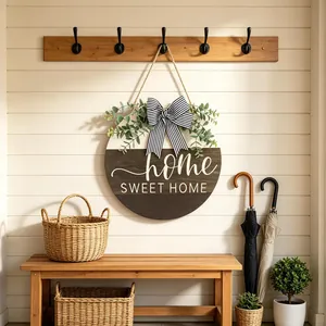 Round wooden Home Sweet Home door hanger with eucalyptus and striped bow
