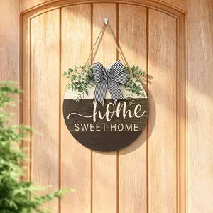 Handcrafted round wooden door hanger with eucalyptus greenery and striped bow sign