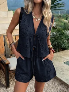 Chic embroidered two-piece set with tie-front vest and shorts for summer resort wear.