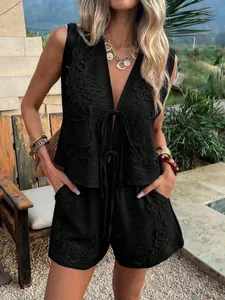 Detailed view of elegant black two-piece summer set with intricate tonal embroidery