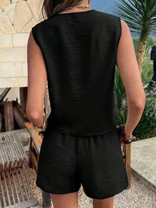 Back view of a chic black sleeveless vest and shorts two-piece set with crinkle texture