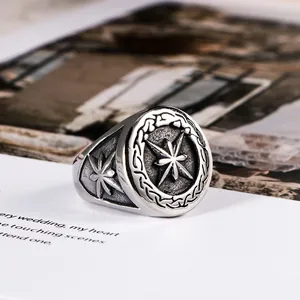 Retro eight-pointed star signet ring for men with vintage silver finish and engraved details