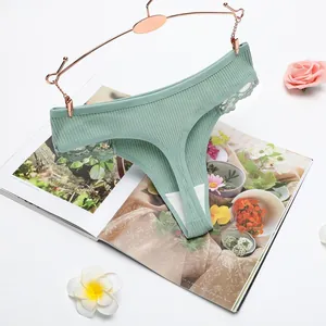 Comfortable women's mint green ribbed cotton thong with lace trim and low waist