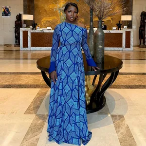 Elegant blue patterned one-shoulder maxi dress with long diagonal sleeves and pleated A-line fit.