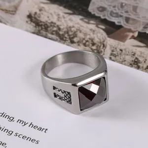 Vintage court style titanium steel ring featuring a large square faceted red gemstone
