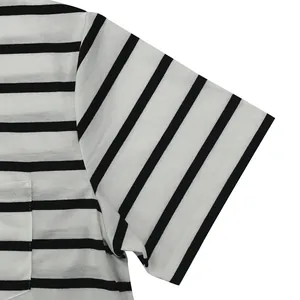 Close-up of sleeve and pocket detail on black and white striped casual T-shirt