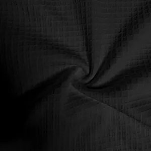 Detailed macro view showing the textured waffle knit pattern of the black heavy men's t-shirt