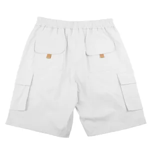 Back view of men's white cargo shorts with functional flap pockets and elastic waist