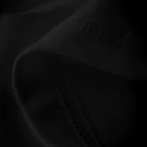 Close-up detail of black knitted fabric texture and stitching on men's casual t-shirt